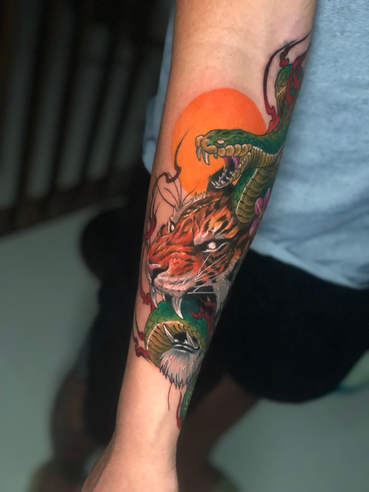 neo traditional tattoo — gorillaz tattoo art studio neo traditional tiger and serpent forearm tattoo — custom ink design by gorillaz tattoo art studio