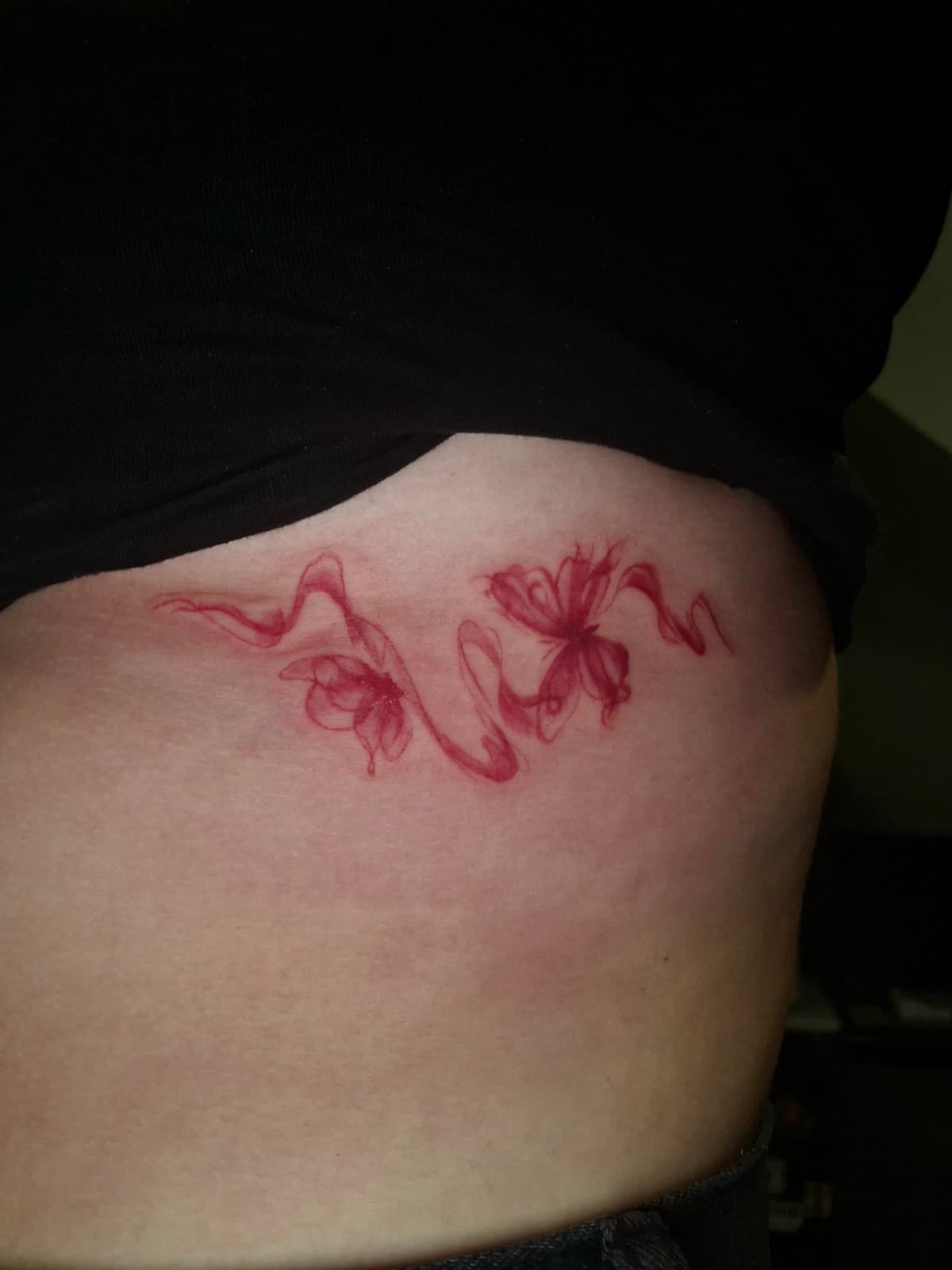 minimalist red ink florals hip tattoo by isaiah recongco — gorillaz tattoo art studio philippines