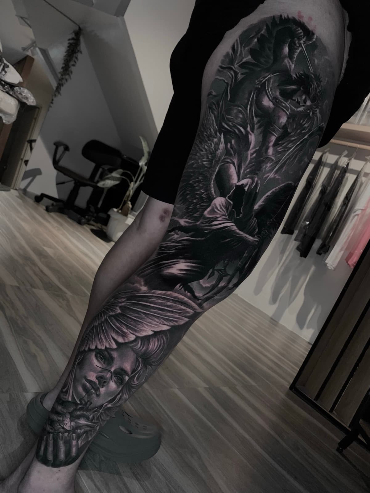 blackwork tattoo — gorillaz tattoo art studio black and grey guardian angel leg sleeve tattoo — custom tattoo portfolio, gorillaz tattoo art studio