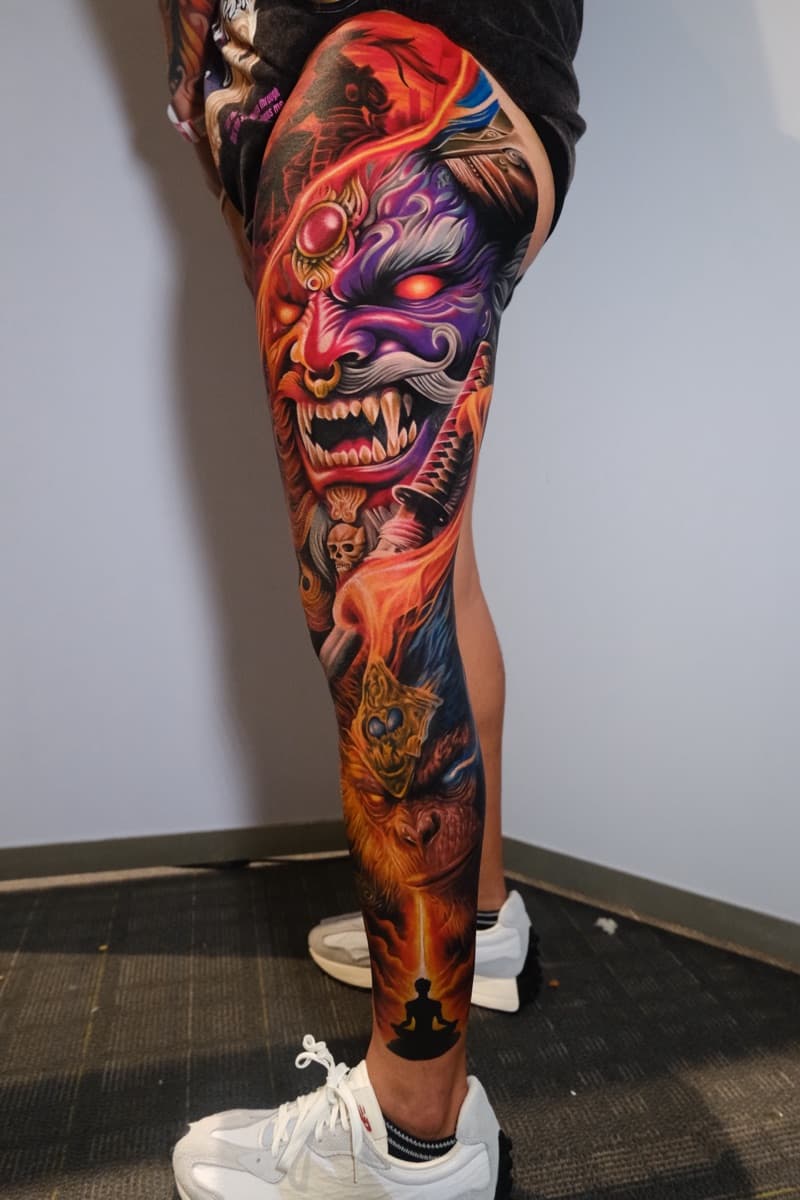 hyper-realism tattoo — gorillaz tattoo art studio hyper-realistic hannya mask and flames leg sleeve tattoo — custom ink design by gorillaz tattoo art studio philippines